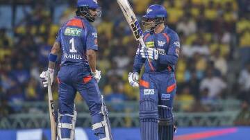 Lucknow's Quinton de Kock (right) celebrates his fifty with fellow opener Lokesh Rahul. (AP PHOTO)
