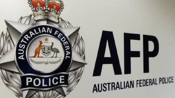 AFP officers have arrested a man in Perth for allegedly breaching his visa-mandated curfew. (Julian Smith/AAP PHOTOS)