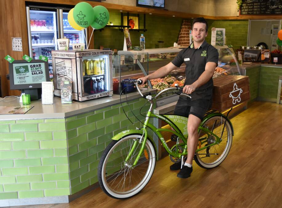 Ready to ride: Sumo Salad Bunbury store owner Daniel Macnish and his staff are set to offer free delivery to their CBD customers via specially-designed bikes. 