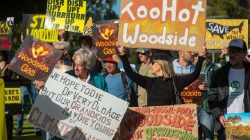 Protesters rally outside the annual general meeting of Woodside Energy in Perth in April. (Aaron Bunch/AAP PHOTOS)