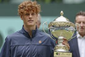 Jannik Sinner holding yet another piece of silverware after his pre-Wimbledon triumph in Halle. (AP PHOTO)