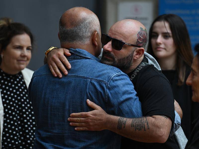 Exaven White (in sunglasses) has tearfully told a court how he was left lost without his son. (Dean Lewins/AAP PHOTOS)