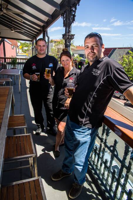 Prince of Wales Hotel owner Mitch Thorn enjoys a hard-earned beer as the venue’s $700,000 renovations near completion. He is pictured with managers Andrew Harnett and Crystal Mather. Picture by Ashley Pearce. 